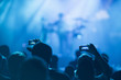 © Robert Kohlhuber/Stocksy - Sillhouettes of concert crowd in front of bright stage lights