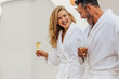 © Jacob Lund - Cheerful couple in bathrobe