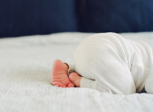 Newborn Baby Boy On Bed