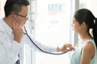 © Pormezz - Asian doctor checking patient heart rate in practitioner procedure before diagnosis.