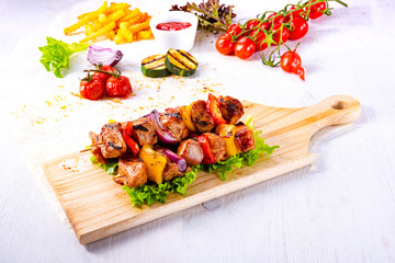 Wall Mural - tasty and colorful meat skewers with peppers and onions