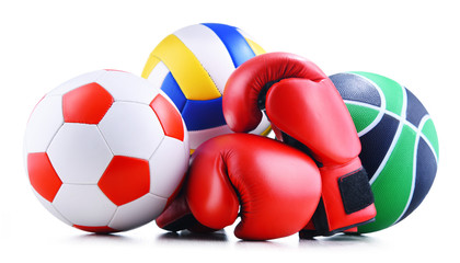 Poster - Three sport balls and boxing gloves over white background