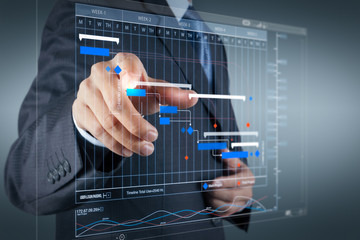 Wall Mural - businessman pressing an imaginary button on virtual screen