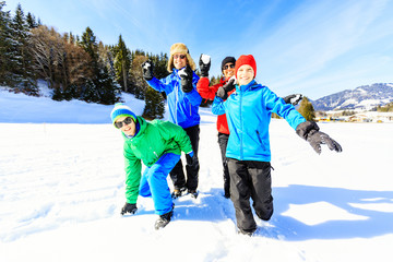 Wall Mural - Family Of Four Having Fun In The Snow