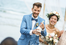 Young Couple In A Wedding Ceremony At The Beach