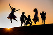 © Irina - five children jump at sunset