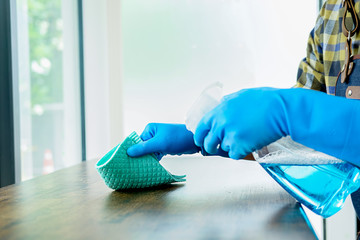 Cleaning Service concept. Cleaners employee removing dirt with equipment in office.