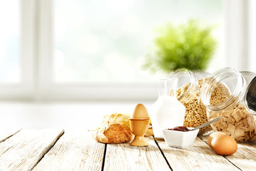 Sticker - Continental breakfast and blurred background of white window with green plant. Free space for your decoration. 