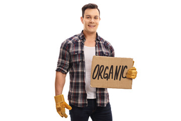 Sticker - Farmer holding a cardboard sign that says organic