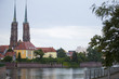 View from behind the river to the Catholic Cathedral of John the Baptist in Wroclaw on the island of Tumski in Poland.
