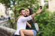 © Westend61 - Couple in love in the city kissing and taking a selfie