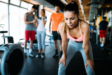 Portrait of tired woman having rest after workout