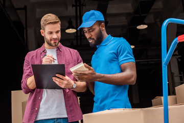 african american courier counting cost of delivery