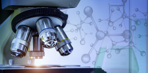 Wall Mural - close-up shot of microscope with metal lens at laboratory