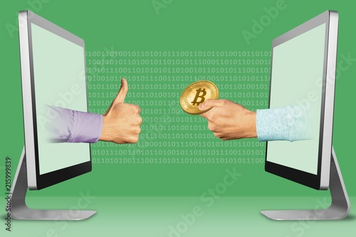 Fotografía The site accept bitcoins concept, two hands from laptops