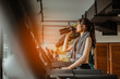 © Take Production - Young woman at treadmill drinking water.Young woman at treadmill drinking .protein shake.