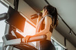 © Take Production - Young woman at treadmill drinking water.Young woman at treadmill drinking .protein shake.