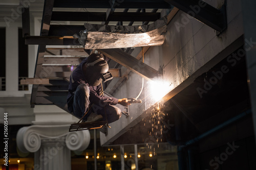 Engineer Steel Welding And Sit On Chair Hang On Building