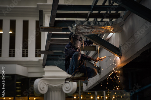 Engineer Steel Welding And Sit On Chair Hang On Building