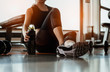 © Take Production - Relaxing after training.beautiful young woman looking away while sitting  at gym.young female at gym taking a break from workout.