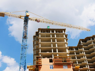 Building under construction. Construction site with crane and building.