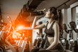 © Take Production - young fitness woman tired in gym drink   protein shake.exercising concept.fitness and healthy lifestyle