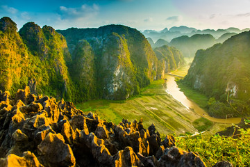 Beautiful sunset landscape viewpoint from the top of Mua Cave mountain, Ninh Binh, Tam Coc in Vietnam