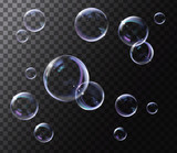 Fototapeta  - Realistic transparent soap bubbles with rainbow reflection. Isolated set composition.