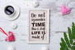 Do not squander time this is stuff life is made of. Quote on rustic wooden background with hearts, coffe and sweets. Top view. Flat lay.