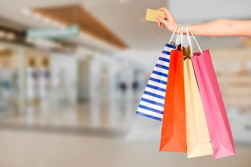 Poster - Woman hand with many shopping