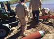 Men Installing Water Transfer Line
