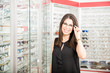 © AntonioDiaz - Happy beautiful woman buying eyewear at the optometrist