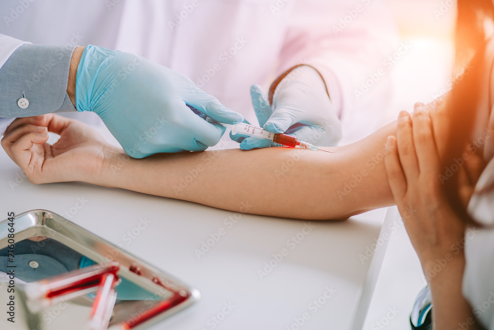 Close up Hand of nurse, doctor or Medical technologist in blue gloves taking blood sample from a patient in the hospital. - obrazy, fototapety, plakaty 