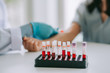 © chompoo - Blood sample Test tube , blurred background  : Hand of nurse, doctor or Medical technologist in blue gloves taking blood sample from a patient in the hospital.