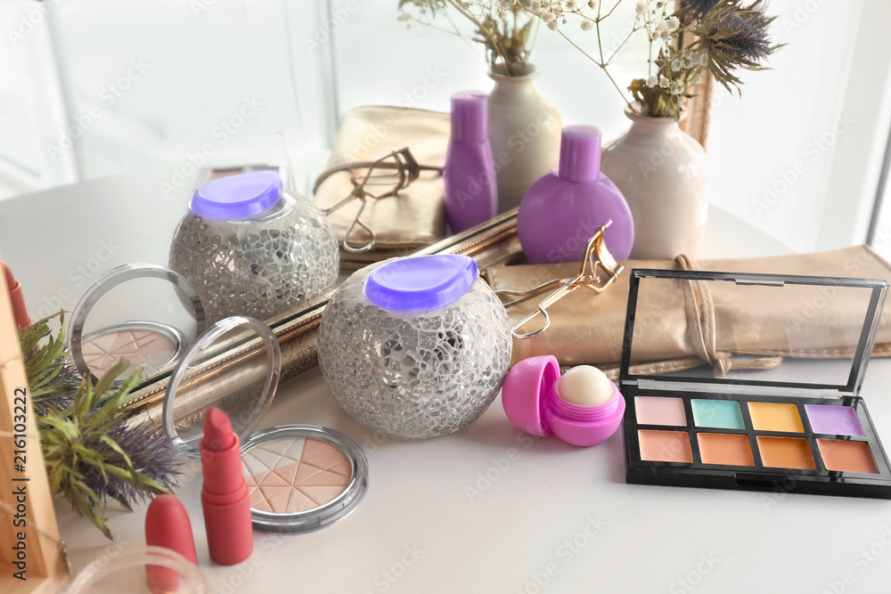 Set of decorative cosmetics on dressing table