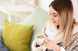 © Pixel-Shot - Morning of beautiful young woman drinking hot coffee at home