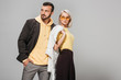 © LIGHTFIELD STUDIOS - couple of models in stylish autumn outfits posing on grey background