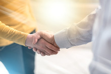 Woman And Man Shaking Hands In Office, Light Effect