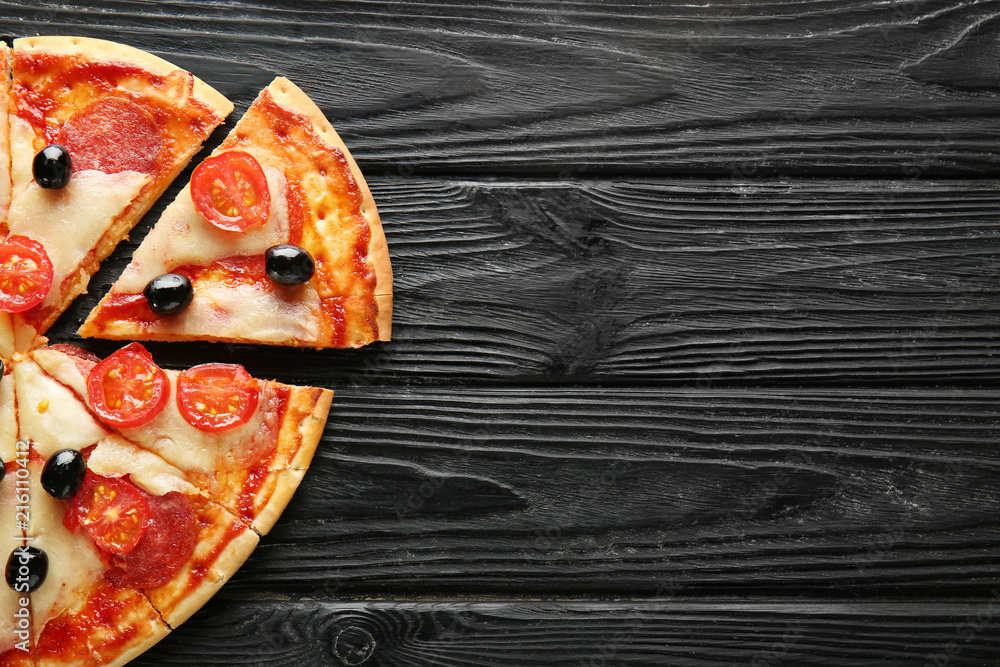 Tasty Italian pizza on wooden table