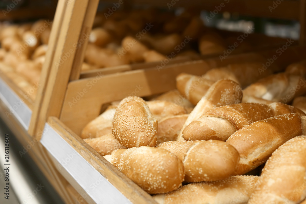 Tasty fresh bakery with sesame seeds on display in shop
