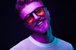 © monchak - Neon portrait of smiling man model with mustaches and beard in orange sunglasses and white t-shirt