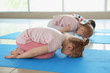 © Pixel-Shot - Little children practicing yoga indoors