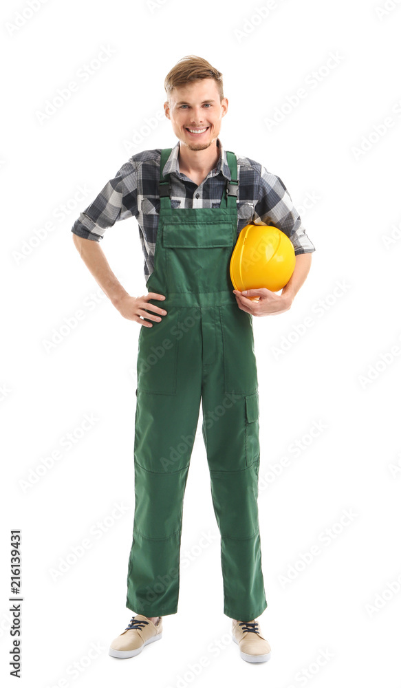 Young male electrician with hardhat on white background