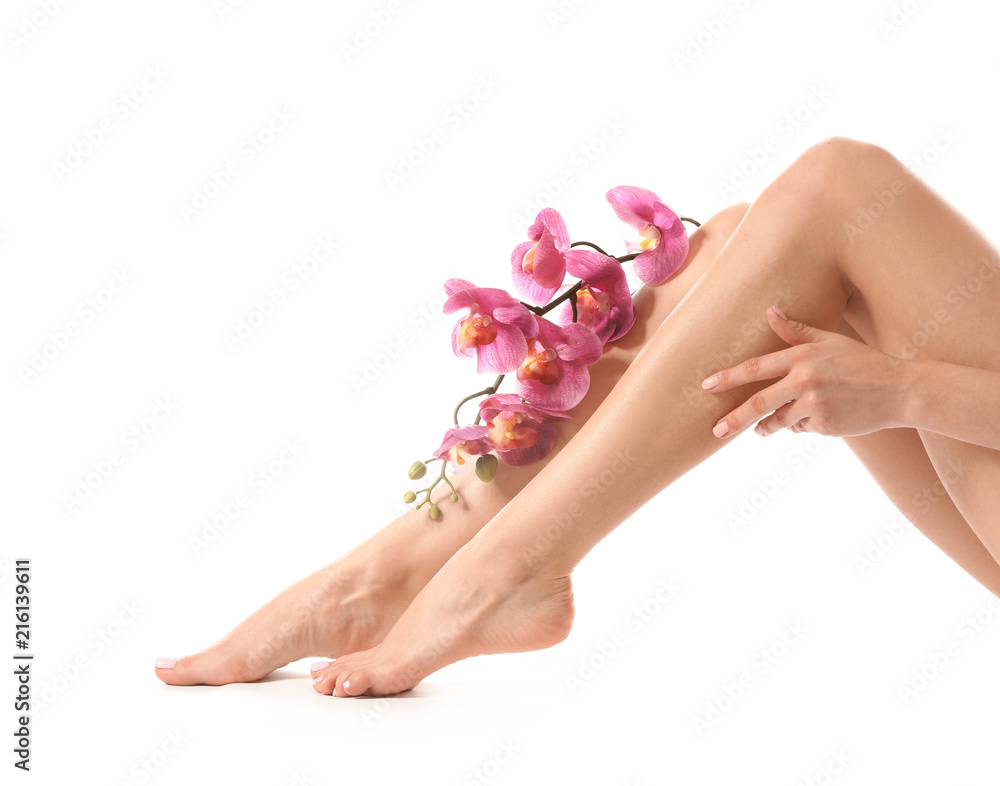 Young woman with silky skin after epilation on white background