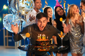 Poster - Young man near his birthday cake at party in club