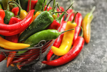 Basket With Fresh Chili Peppers On Grey Background, Closeup