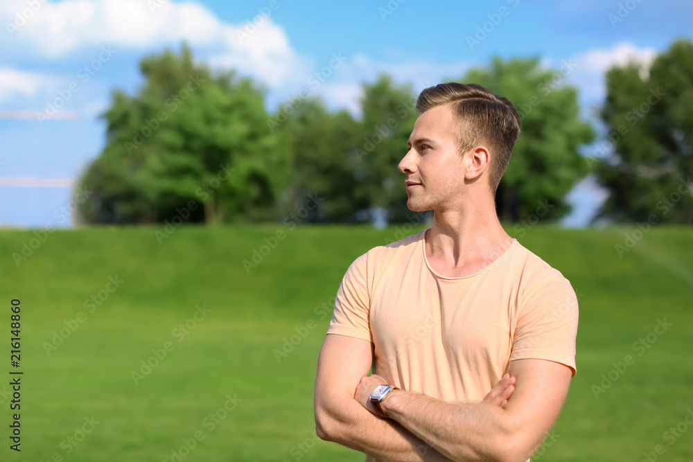 Young man in park on sunny day