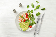 Plate With Tasty Grilled Chicken Fillet And Vegetables On White Wooden Table