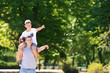 © Pixel-Shot - Dad and son with rugby ball outdoors