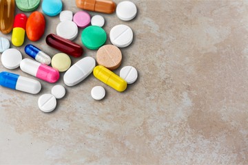 Colorful pills and tablets on background